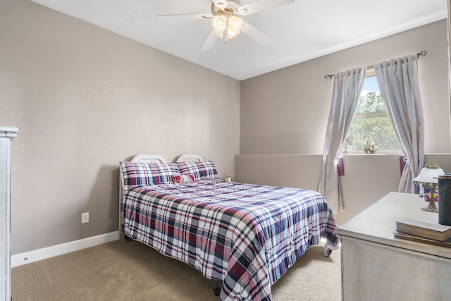 bedroom featuring light colored carpet and ceiling fan