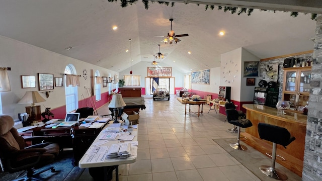 interior space with ceiling fan and lofted ceiling