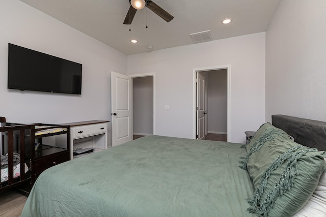 bedroom with hardwood / wood-style flooring and ceiling fan