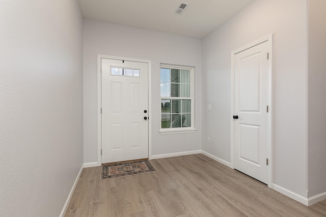 entryway with light hardwood / wood-style floors