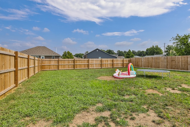 view of yard featuring a trampoline