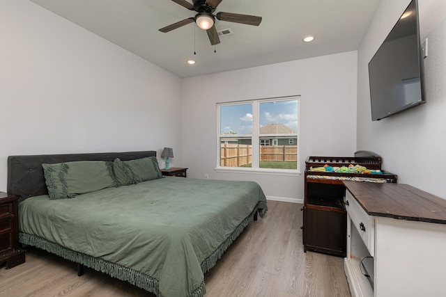 bedroom featuring light hardwood / wood-style floors and ceiling fan