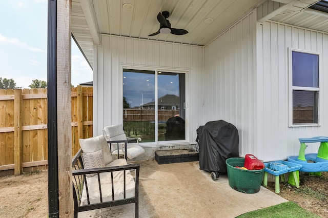 view of patio featuring area for grilling and ceiling fan