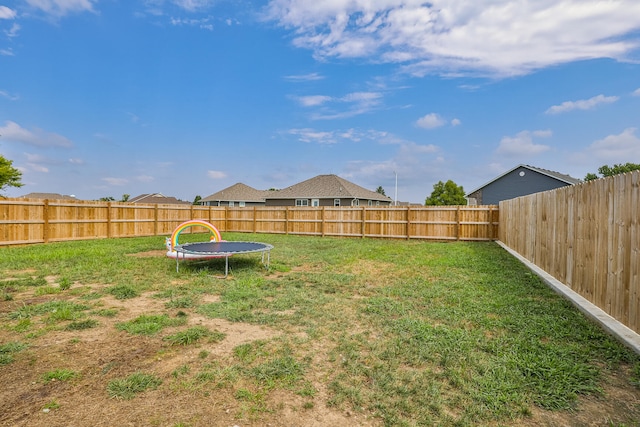 view of yard with a trampoline