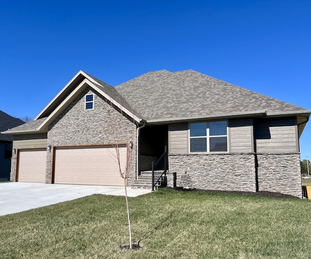 view of front facade with concrete driveway, an attached garage, stone siding, a front yard, and a shingled roof