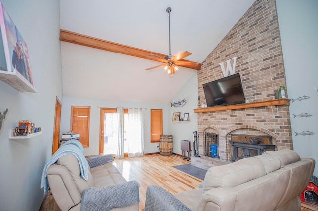 living room with high vaulted ceiling, ceiling fan, a fireplace, and wood-type flooring