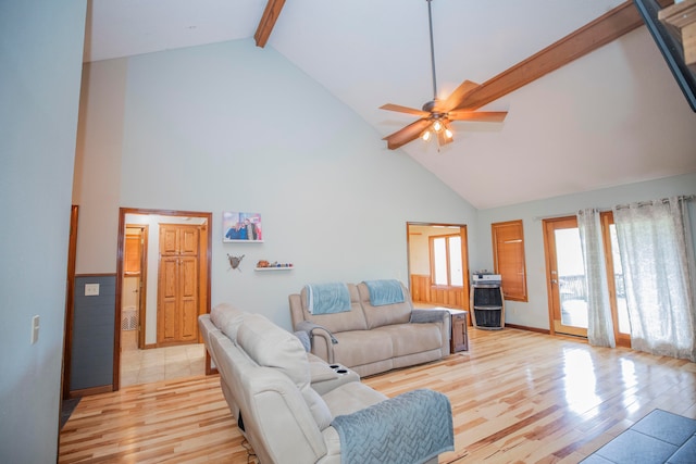 living room featuring high vaulted ceiling, light hardwood / wood-style flooring, beamed ceiling, and ceiling fan