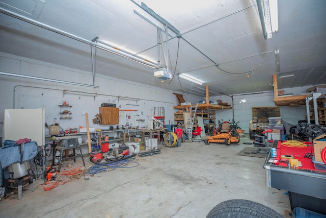 garage featuring a garage door opener and a workshop area