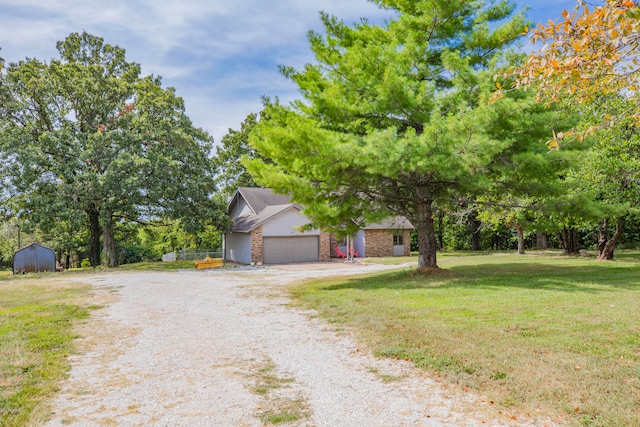 view of front facade with a front yard and a garage