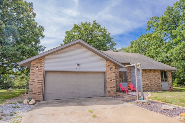 ranch-style house featuring a garage