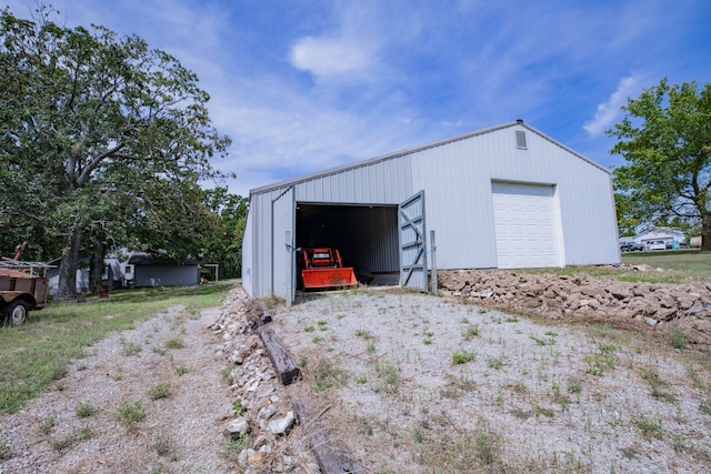 garage featuring wood walls