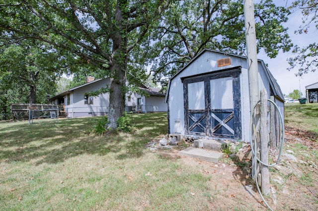 view of outdoor structure with a lawn