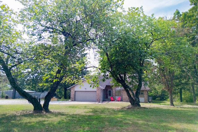 view of front facade with a front lawn and a garage