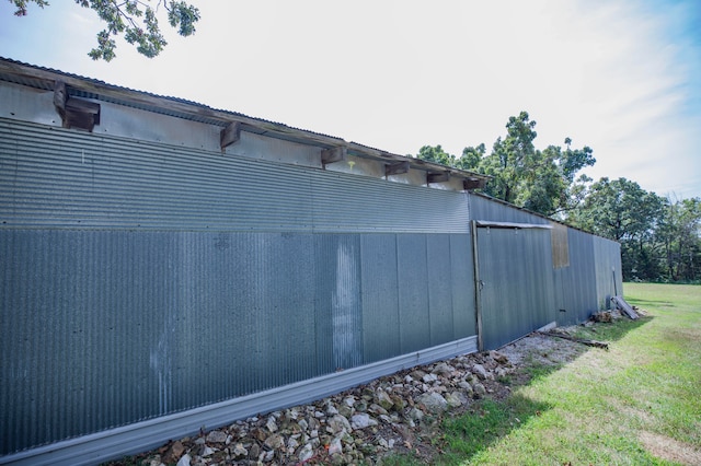 view of home's exterior with a lawn