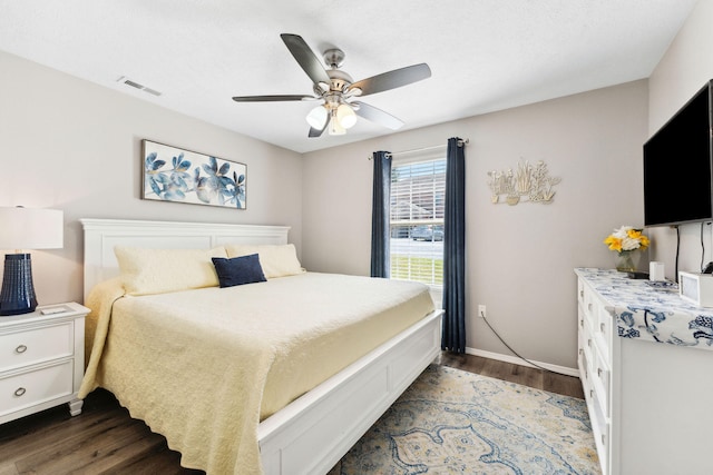 bedroom with dark wood-type flooring and ceiling fan