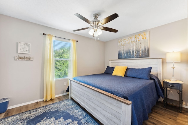 bedroom featuring ceiling fan and dark hardwood / wood-style flooring