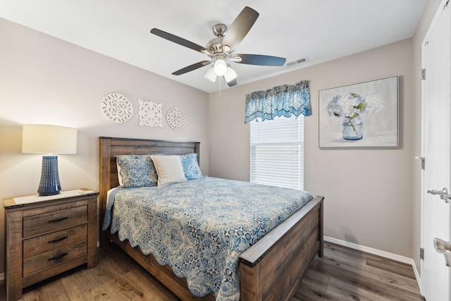 bedroom featuring ceiling fan and dark hardwood / wood-style flooring