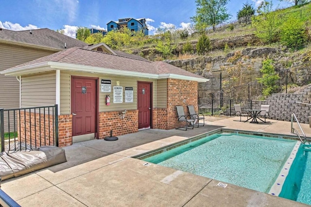 view of swimming pool with a patio area