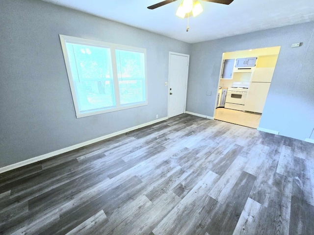 interior space featuring ceiling fan and dark hardwood / wood-style floors