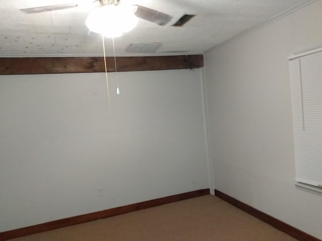 spare room with ceiling fan and baseboards