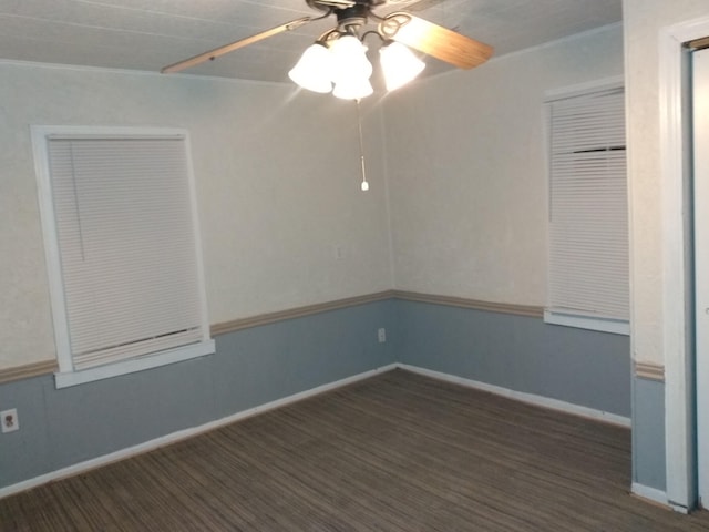 empty room with ceiling fan, baseboards, and ornamental molding