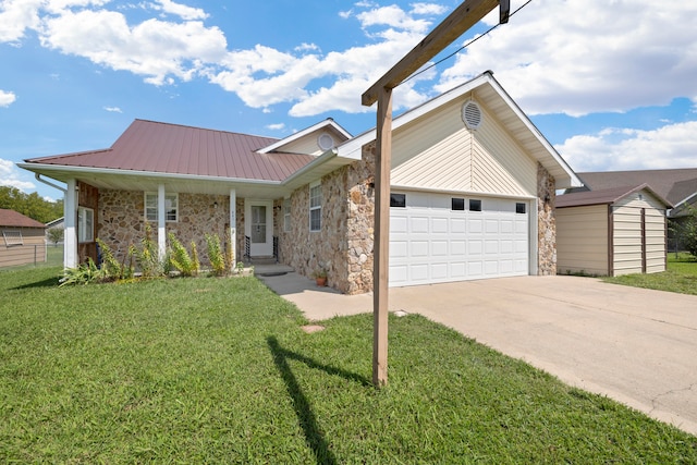 view of front of house with a front yard and a garage