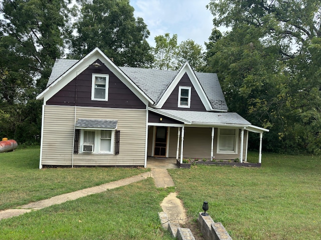 view of front of house with a front lawn and cooling unit