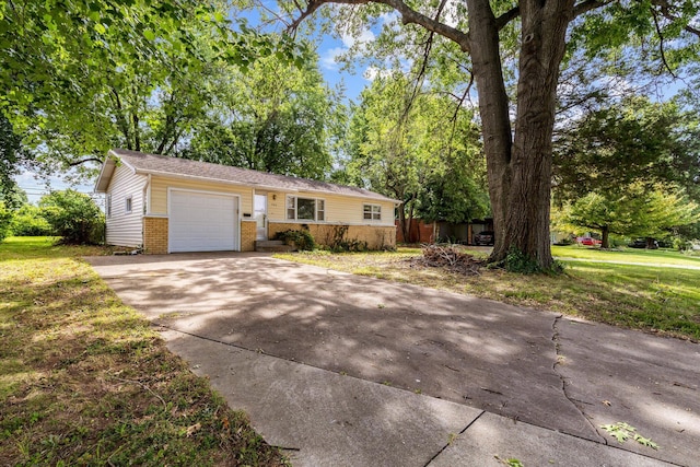 ranch-style house with a front yard and a garage