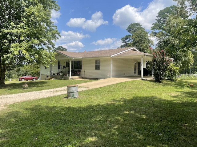 rear view of property featuring a yard