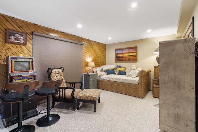 interior space featuring carpet floors, wood walls, and recessed lighting