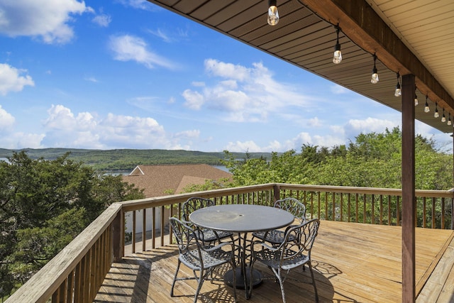 deck with outdoor dining area