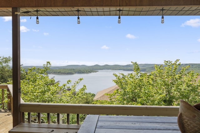 exterior space featuring a water and mountain view