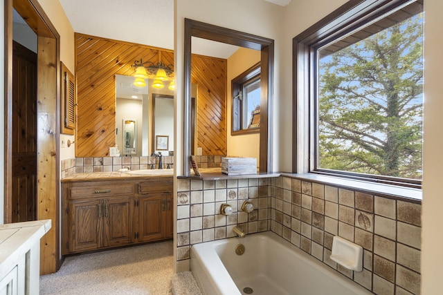 91 Blueview Ln, Kimberling City, MO 65686 - bathroom featuring a bath, wood walls, and vanity
