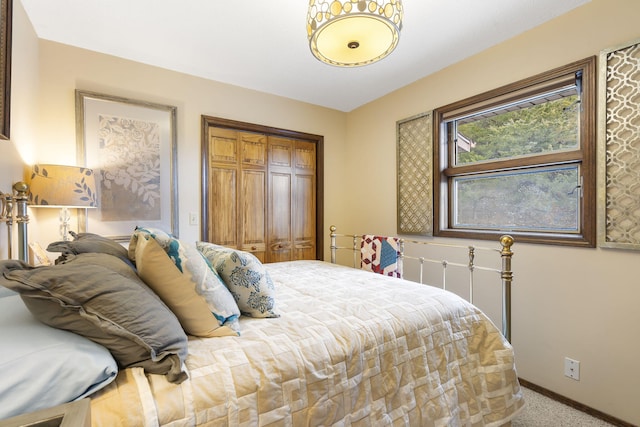 91 Blueview Ln, Kimberling City, MO 65686 - bedroom featuring light carpet, baseboards, and a closet