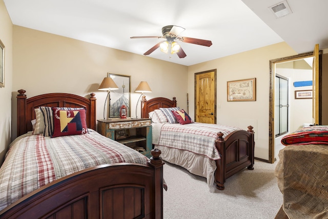 bedroom with a ceiling fan, visible vents, and carpet flooring