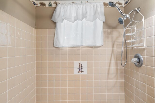 bathroom with tiled shower