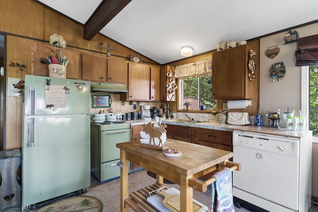 kitchen with light countertops, white dishwasher, freestanding refrigerator, lofted ceiling with beams, and range