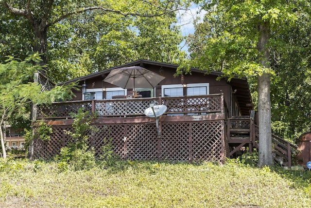 rear view of property with a deck