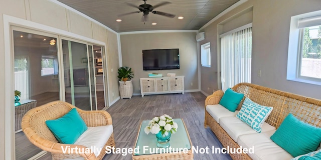living area with a ceiling fan, crown molding, baseboards, dark wood-style flooring, and recessed lighting