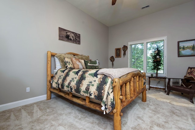 bedroom with carpet, visible vents, baseboards, and ceiling fan