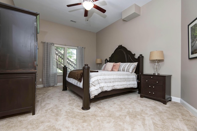 bedroom with light colored carpet, ceiling fan, baseboards, and visible vents