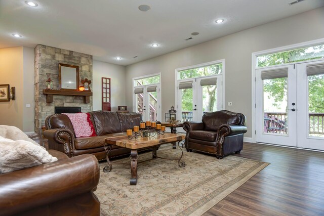 living area with recessed lighting, dark wood-style floors, and french doors