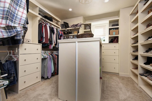 spacious closet featuring carpet flooring