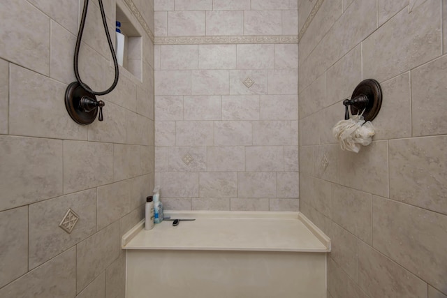 bathroom featuring tiled shower