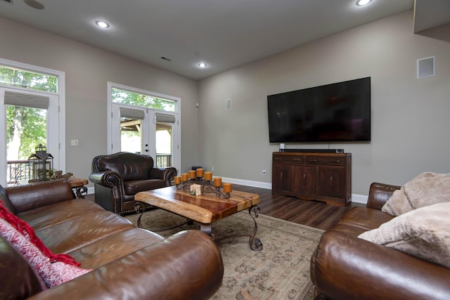 living room featuring recessed lighting, wood finished floors, and baseboards