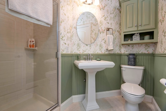 bathroom with walk in shower, tile patterned flooring, and toilet