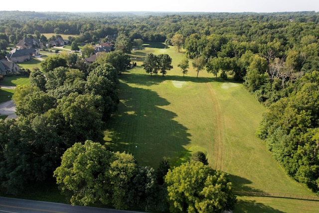 birds eye view of property featuring a view of trees