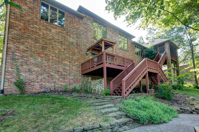 rear view of house featuring a deck