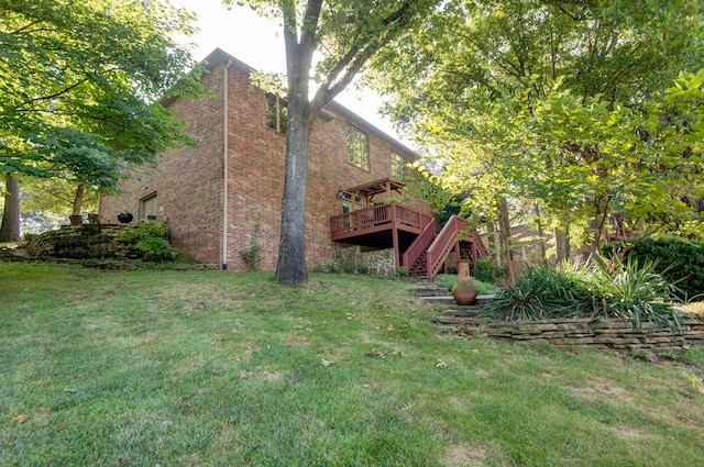 view of yard with a wooden deck