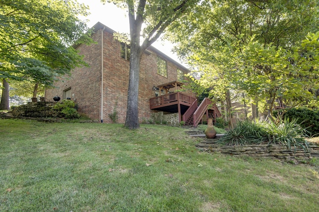 view of yard featuring a wooden deck and stairs